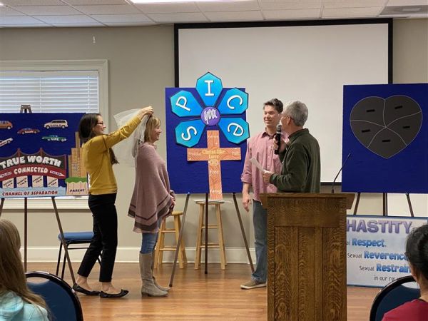 Participants discuss virtue, chastity, Christlike love, peer pressure, and improving parent-teen communication at Family Honor’s Real Love & Real Life program for parents with 7th and 8th graders, where. Credit: Family Honor, Inc.