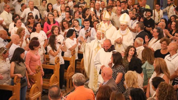 Bishop Hanna Jallouf, OFM, walks down the center aisle of St. Francis Church in Aleppo, Syria, after his episcopal ordination Sept. 17, 2023. Credit: Photo courtesy of TEWK CENTRE
