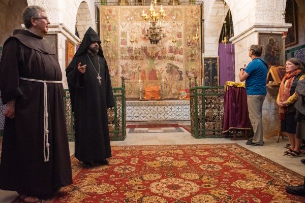 The Franciscan friars and the faithful in the Armenian Church of the Holy Archangels in Jerusalem after the Mass of the Lord's Supper celebrated at the Cenacle on March 28, 2024. Friars and faithful pray together and receive the blessing from the representative of the Armenian Apostolic Church. Credit: Marinella Bandini