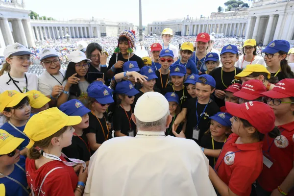 Pope Francis speaks with a group of children in St. Peter's Square in Rome during the first World Day of Children on Saturday, May 26, 2024. Credit: Daniel Ibañez/CNA