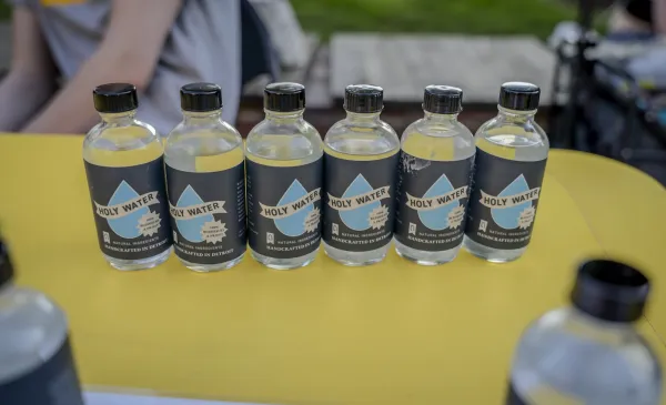 The bottles used in the ministry are repurposed from the bottles given to parishes each year for the distribution of sacred oils, blessed by the archbishop during the annual Chrism Mass on Holy Thursday. Aug. 26, 2024. Credit: Valaurian Waller | Detroit Catholic)