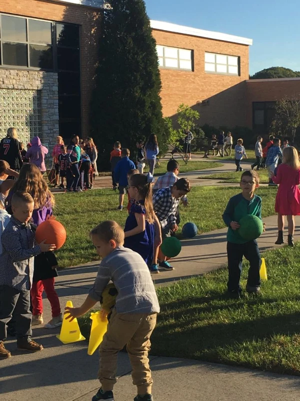 Kids play at a South Carolina Let Grow Play Club, where schools stay open before or after school for mixed-age, no-devices free play: without adults organizing their games or solving their disagreements. Credit: Kevin Stinehart/Let Grow