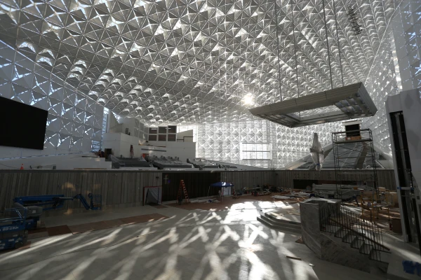 The sun sets through the distinctive quatrefoils of Christ Cathedral as construction and renovation continue inside the space formerly known as the Crystal Cathedral on Feb. 7, 2019. Credit: Challenge Roddie/Diocese of Orange