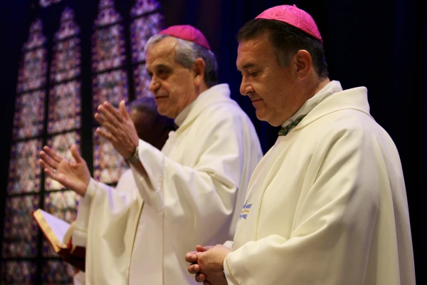 Auxiliary Bishop Eusebio Elizondo of the Archdiocese of Seattle (left) and Auxiliary Bishop Mario A. Avilés of Brownsville, Texas, celebrate Mass during the 2024 Conference of the National Catholic Association of Diocesan Directors for Hispanic Ministry. Credit: Emily Chaffins