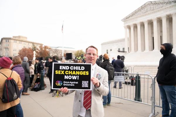A demonstrator holds a sign opposing sex changes for minors at a rally on the steps of the United States Supreme Court on Dec. 4, 2024, as justices heard oral arguments in a challenge to a Tennessee law banning transgender surgeries for minors. Credit: Madalaine Elhabbal/CNA