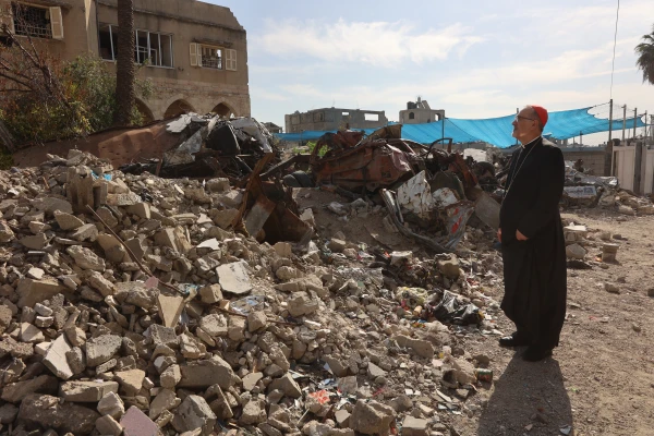 The Latin patriarch of Jerusalem, Cardinal Pierbattista Pizzaballa, observes a pile of rubble during his visit to Gaza on Dec. 22, 2024. Credit: Photo courtesy of the Latin Patriarchate of Jerusalem