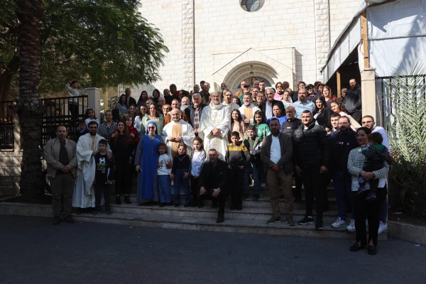 Group photo in front of the Church of the Holy Family in Gaza during the visit of the Latin patriarch of Jerusalem, Cardinal Pierbattista Pizzaballa, on Dec. 22, 2024. Credit: Photo courtesy of the Latin Patriarchate of Jerusalem