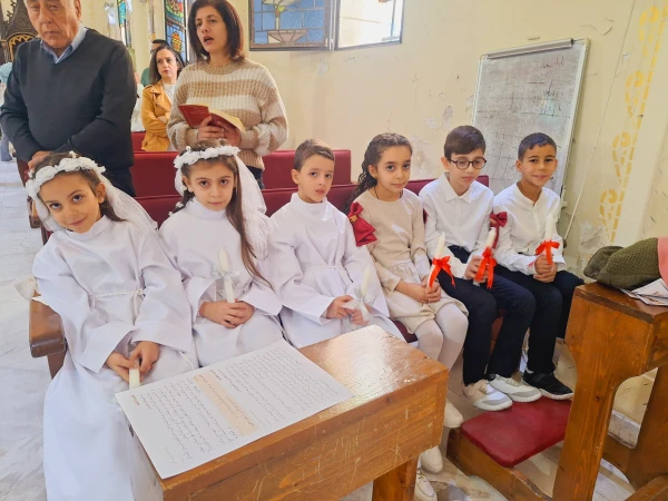Six refugee children at the Latin Parish of the Holy Family in Gaza received their first Communion and confirmation during the visit of the Latin Patriarch of Jerusalem, Cardinal Pierbattista Pizzaballa, on Dec. 22, 2024. Courtesy of Latin Patriarchate of Jerusalem