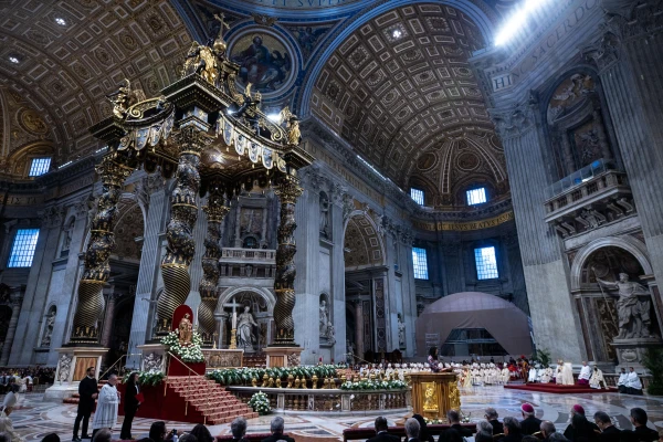 A view of St. Peter's Basilica during the Mass for the solemnity of the Immaculate Conception, with Bernini's baldachin and the papal altar decorated with white flowers, Dec. 8, 2024. Credit: Daniel Ibáñez/CNA