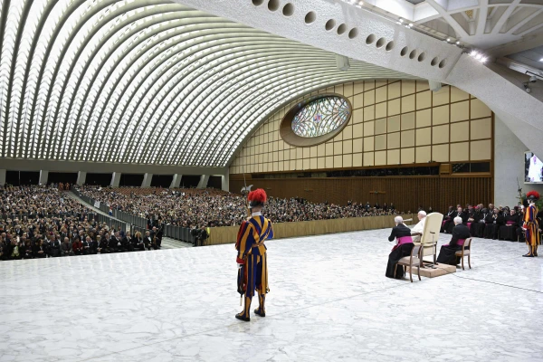 A Swiss Guard stands watch as Pope Francis addresses hundreds of communications professionals gathered in the Paul VI Audience Hall for the Jubilee of the World of Communications, Jan. 25, 2025. Credit: Vatican Media