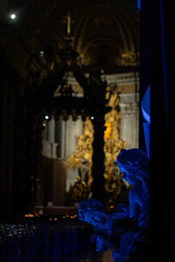 Angelic figures bathed in blue light inside St. Peter's Basilica during the "White Night at St. Peter's" event, part of the Jubilee of Artists at the Vatican, Feb. 16, 2025. Credit: Daniel Ibáñez/CNA