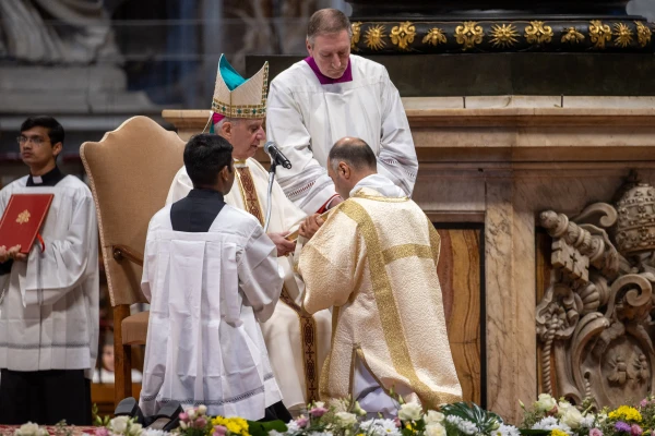 Archbishop Rino Fisichella performs the ordination rite during the Jubilee Mass for Deacons at St. Peter's Basilica, Feb. 23, 2025. Credit: Daniel Ibáñez/CNA