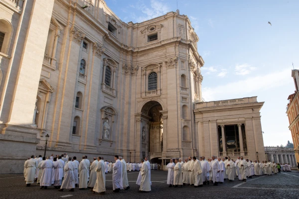 Deacons in white albs gather outside St. Peter’s Basilica before the Jubilee Mass celebration at the Vatican, Feb. 23, 2025. Credit: Daniel Ibáñez/CNA
