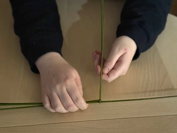 Making a St. Brigid cross. Credit: Joe Passmore