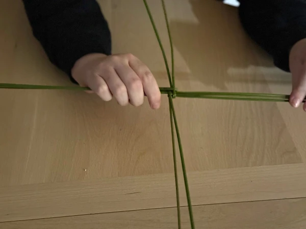 Making a St. Brigid cross. Credit: Joe Passmore
