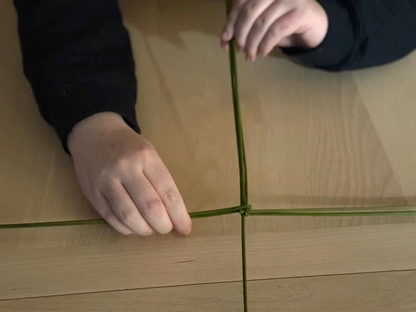 Making a St. Brigid cross. Credit: Joe Passmore