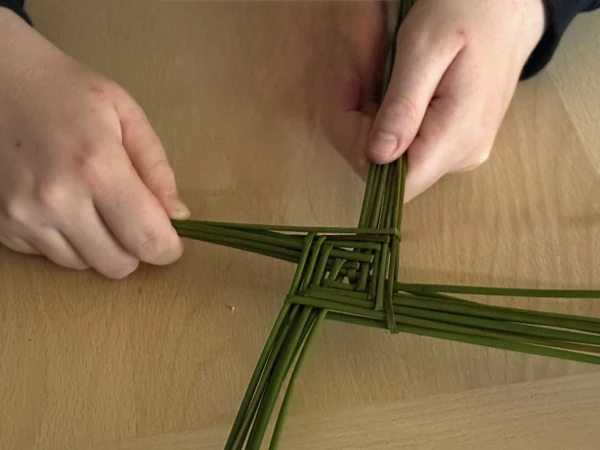 Making a St. Brigid cross. Credit: Joe Passmore