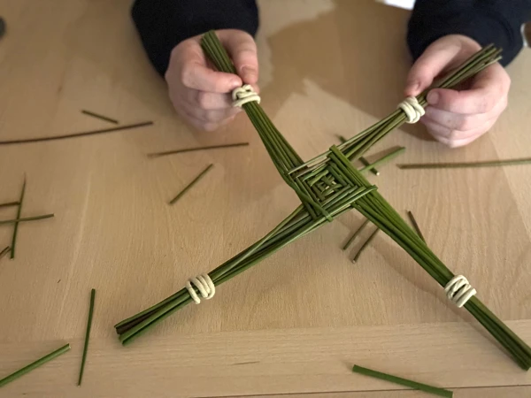 Making a St. Brigid cross. Credit: Joe Passmore