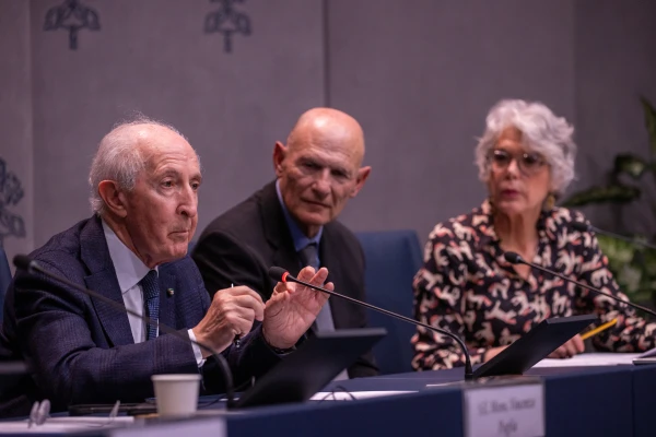 Giulio Maira (left), a neurosurgeon who previously worked at Rome’s Gemelli Hospital, speaks at a press conference on the Vatican longevity summit on March 24, 2025. He told CNA after the press conference that “frailty is the ultimate expression of aging.”. Credit: Daniel Ibañez/CNA