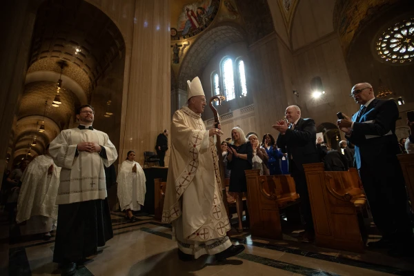 The faithful greet Cardinal Robert McElroy as he processes out of the Basilica of the National Shrine of the Immaculate Conception in Washington, DC March 11, 2025. Credit: Patrick Ruddy/CNA