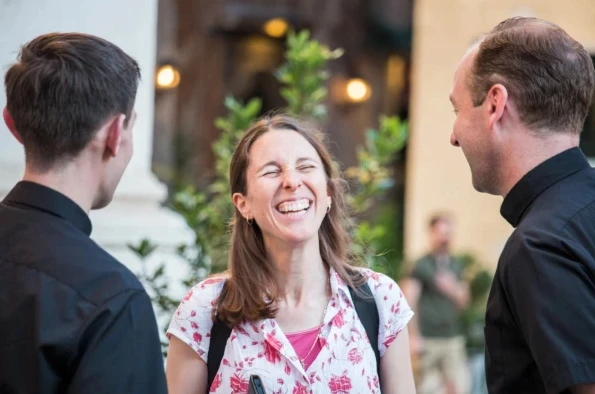 Mary Patt Pirie converses with two priests. Credit: Courtesy of Regnum Christi