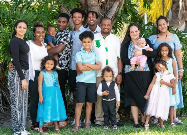 Founder and executive director of Grace Center Marcie Erickson (at right, holding baby) is pictured here with her husband, Sefinew Birhan Mengistu, the center's director of expansion, and their 12 children. Credit: Susan Culey
