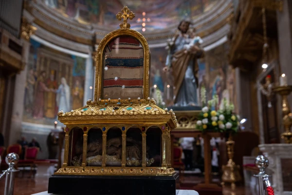 A reliquary said to contain a piece of St. Joseph’s cloak (at the bottom) and a fragment of the Virgin Mary’s veil (at the top) is displayed for the faithful at San Giuseppe al Trionfale Parish in Rome on March 19, 2025. Credit: Daniel Ibáñez/CNA