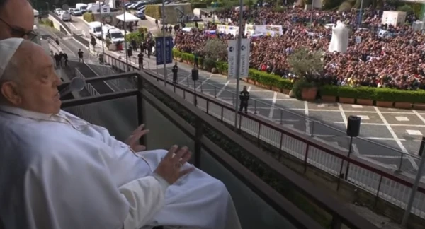 Pope Francis waves to the gathered faithful from the balcony at Gemelli Hospital in Rome on Sunday, March 23, 2025. Credit: Vatican Media/Screenshot
