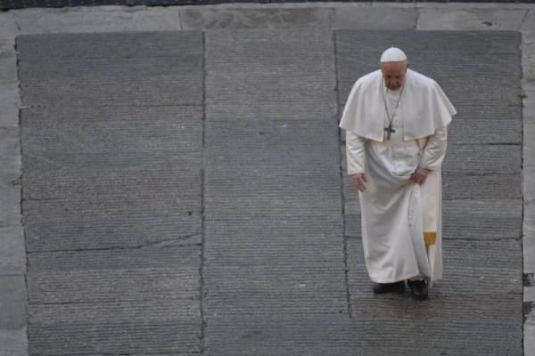 Pope Francis walks through St. Peter's Square before delivering an urbi et orbi prayer on Friday, March 27, 2020. Credit: Vatican Media