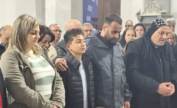 Deacon Johnny Fouad Dawoud gives thanks with his family and friends at Mass after his release from prison in Syria. Credit: Photo courtesy of Deacon Johnny Fouad Dawoud