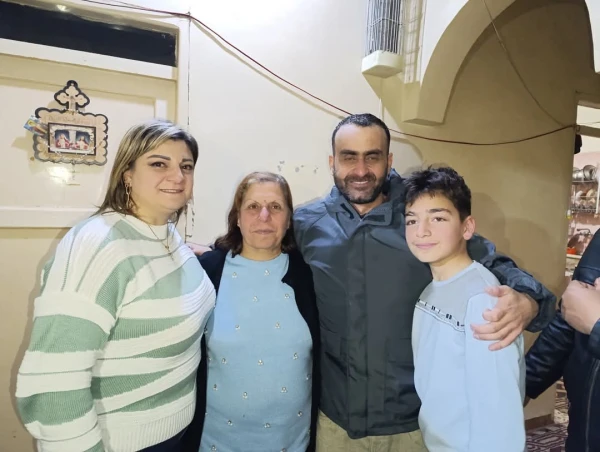 Deacon Johnny Al-Daoud, pictured with family members, was released from captivity in Syria on March 2, 2025. Credit: St. Michael's Church - Maskana Parish