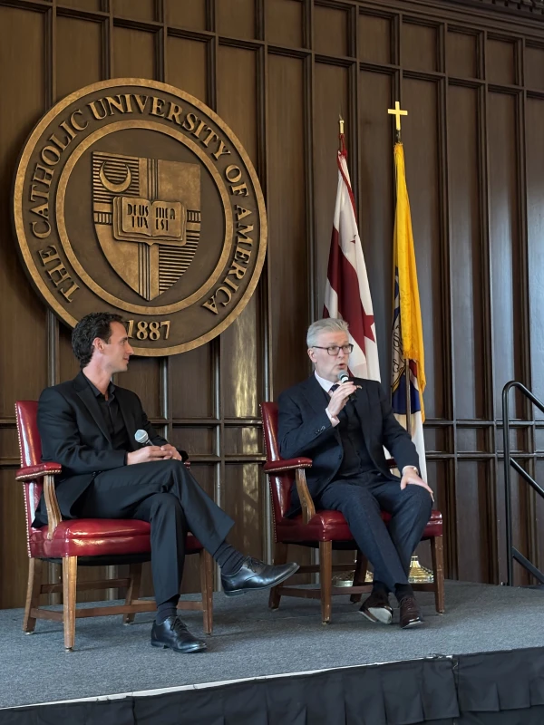 Sir James MacMillan (right) discusses the topic of "Beauty, Music, and Faith" with Peter Kadeli (left), assistant&nbsp;professor and head of the sacred music program at The Catholic University of America, on April 9, 2025. Credit: Jem Sullivan/The Catholic University of America