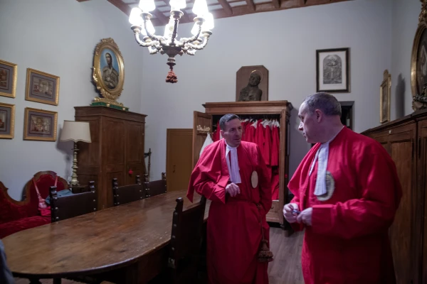 Jörn Sesterhenn, left, and Fabrizio Azzola, right, discuss preparations for the washing of the feet in Rome, Monday, March 25, 2025. Credit: Hannah Brockhaus/CNA