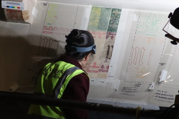 A worker creates stencils from revealed patterns as part of the restorations of Nottingham's Catholic cathedral. Credit: Diocese of Nottingham/Naomi Archer-Roberts