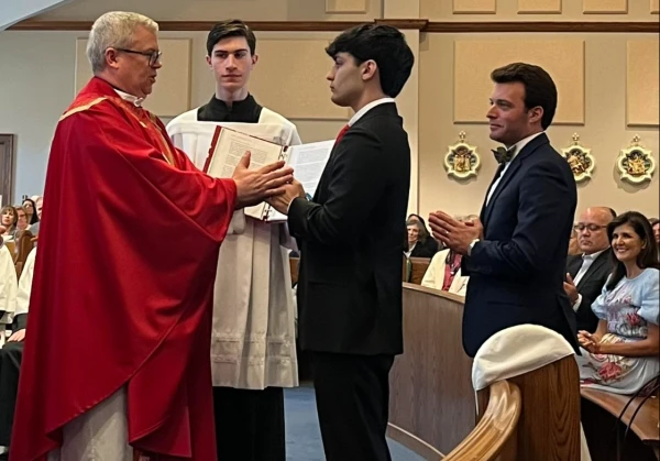 As his parents look on, Nalin Haley is received into the Catholic Church by Father Jeffrey Kirby at Our Lady of Grace Catholic Church in Indian Land, South Carolina on April 13, 2025. Credit: Photo courtesy of Father Jeffrey Kirby and Our Lady of Grace Catholic Church/Facebook page