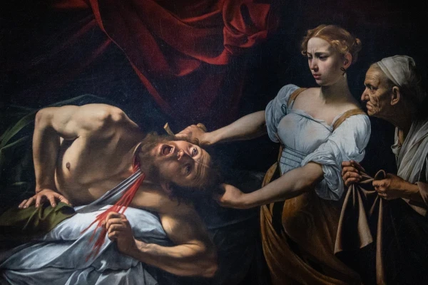 In “Judith Beheading Holofernes,” Caravaggio recreated a biblical story transformed into an allegory of good conquering evil. Credit: Daniel Ibañez/EWTN News