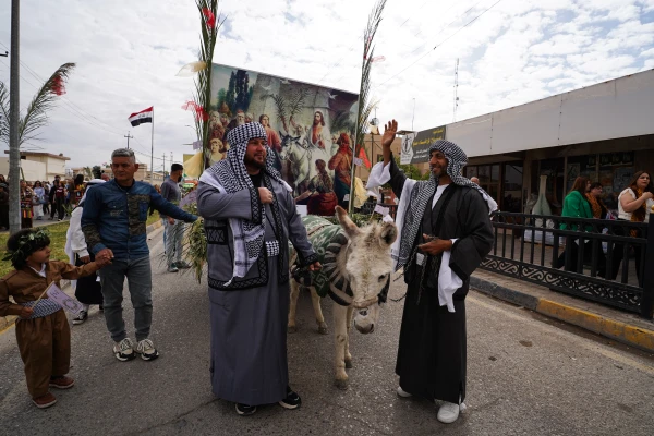 The streets of Qaraqosh — also known as Baghdeda — are filled with joy as residents celebrate Palm Sunday on April 13, 2025, carrying olive branches and palm fronds in a grand procession of nearly 20,000 Christians. Credit: Ismael Adnan/ACI MENA