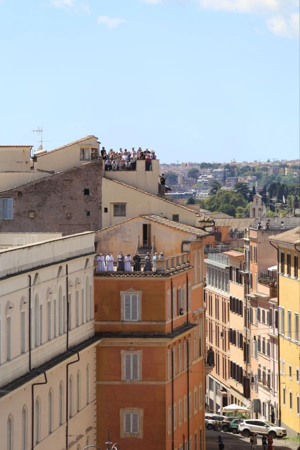 Observers gather on rooftops to watch as the coffin of Pope Francis processes to St. Mary Major in Rome, Saturday, April 26, 2025. Credit: Zosia Czubak/EWTN