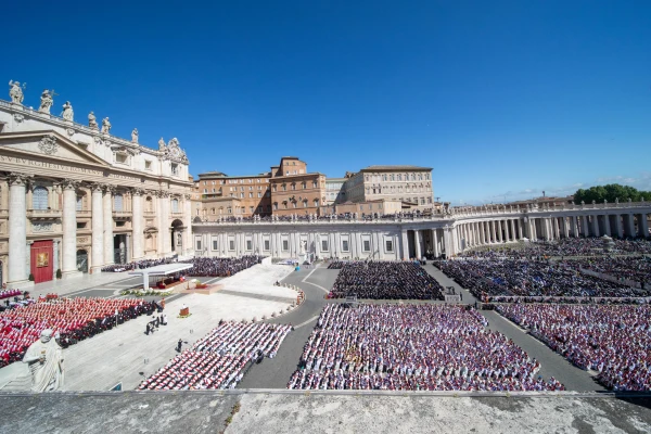 An aerial view of St. Peter's Square filled with thousands of mourners, clergy, and dignitaries gathered for Pope Francis's funeral Mass under clear blue skies in Vatican City on April 26, 2025.`. Credit: Daniel Ibáñez/CNA