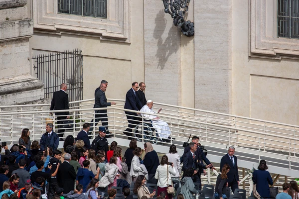 Pope Francis offers a blessing to the gathered faithful from a ramp at St. Peter's Basilica during Palm Sunday celebrations, April 13, 2025. The Holy Father made a brief appearance following the main liturgy presided over by Cardinal Sandri. Credit: Bénédicte Cedergren / EWTN News