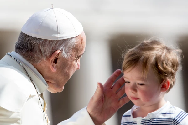Pope Francis greets a young visitor at his general audience at the Vatican on Wednesday, May 30, 2018. Credit: Daniel Ibáñez/CNA