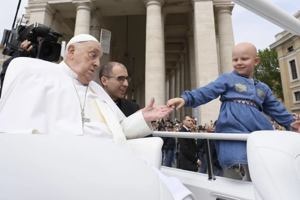 Pope Francis reaches out to a child on April 20, 2025. Credit: Vatican Media