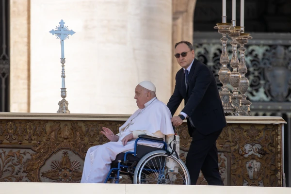 Pope Francis blesses the faithful at the Jubilee of the Sick in St. Peter's Square, Vatican City, on April 6, 2025, as his personal nurse, Massimo Strappetti, assists him in the wheelchair. Credit: Daniel Ibáñez/CNA