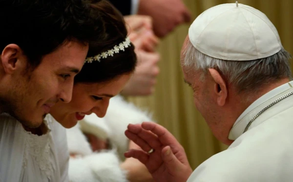 Pope Francis blesses newlyweds as he meets with attendees during the weekly general audience on Feb. 12, 2020, at Paul VI Audience Hall in the Vatican. Credit: FILIPPO MONTEFORTE/AFP via Getty Images