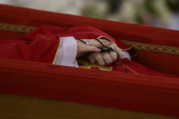 Pope Francis' hands are seen as his body lies in state at the Vatican's Domus Sanctae Marthae chapel, Monday, April 21, 2025. Credit: Vatican Media
