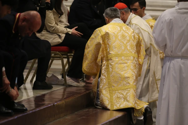 Cardinal Mauro Gambetti kneels to wash the feet of laypeople during the traditional Holy Thursday ritual at St. Peter's Basilica, Vatican City, April 17, 2025. Credit: Zofia Czubak/EWTN News