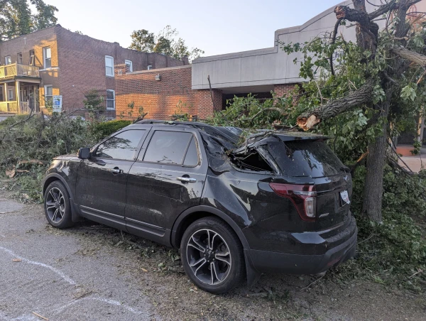 A crushed car in north St. Louis following the May 16, 2025, tornado. Credit: Photo courtesy of Father Scott Scheiderer