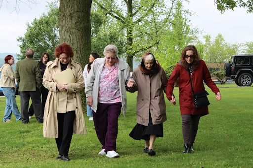 Sister Gemma Del Duca attends the planting of the Anne Frank tree in early May. Left to right: Seton Hill President Mary Finger; Sister Vivien; Sister Gemma; and Lauren Bairnsfather. Behind them are a few of the Seton Hill students who were in attendance. Credit: Photo courtesy of Seton Hill University