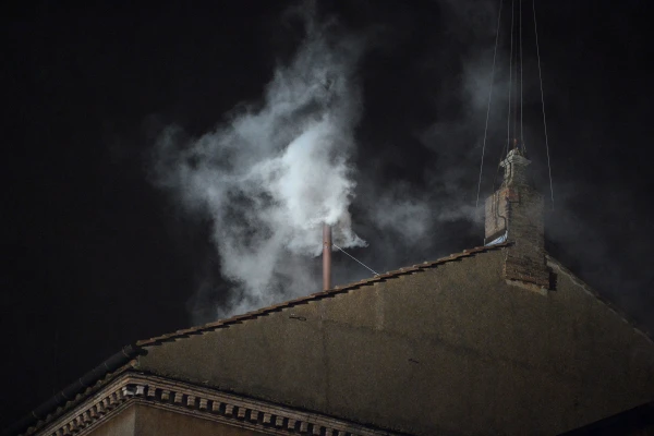 White smoke rises from the chimney of the Sistine Chapel on March 13, 2013, signaling that the College of Cardinals has elected a new pope. Credit: ALBERTO PIZZOLI/AFP via Getty Images