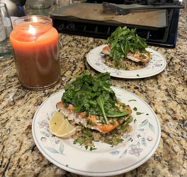 Salmon with vegetable risotto and arugula salad. Credit: Miscellaneous contributor, CC0, via Wikimedia Commons